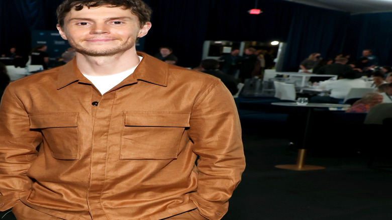 Evan Peters brown shirt