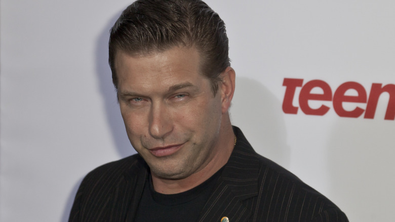 Stephen Baldwin smirking wearing suit