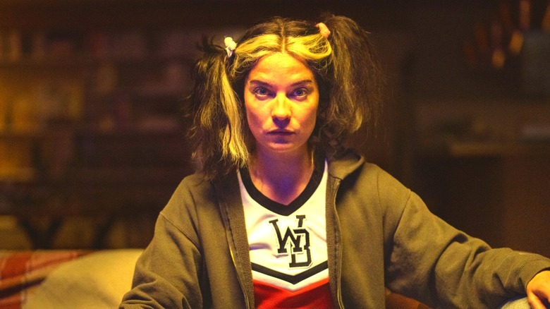 A disheveled Joan in a cheerleader uniform in "Black Mirror" (2023)