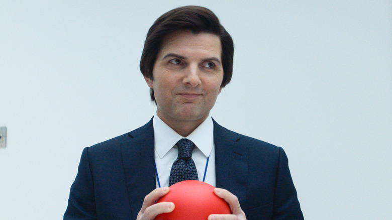 Mark holds a red ball in 