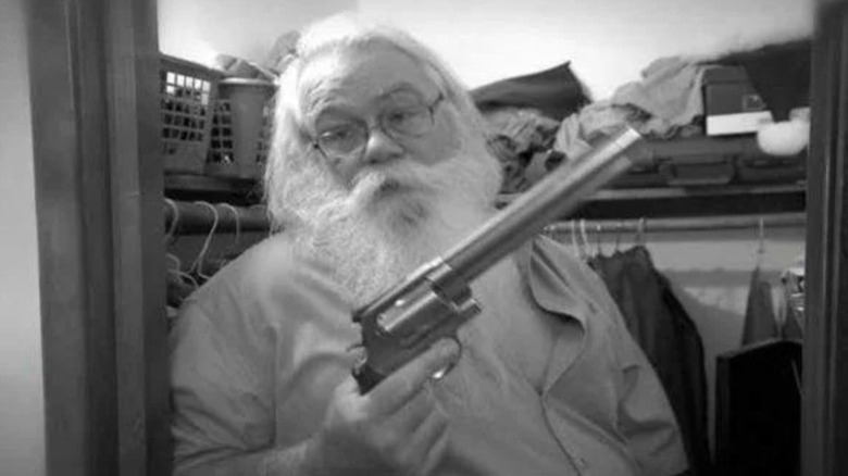 Mall Santa holding a gun