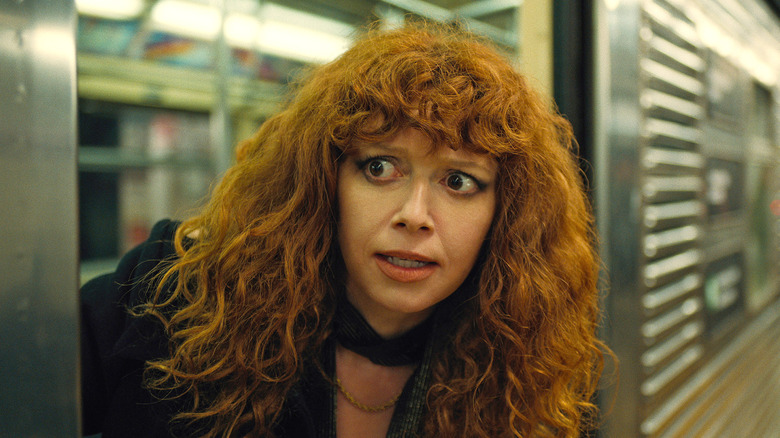 Nadia poking her head out of a subway car on Russian Doll