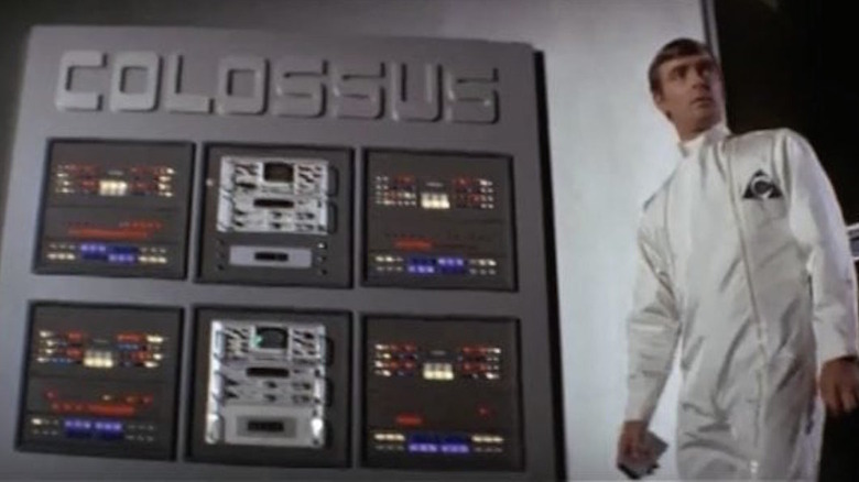 Eric Braeden stands near a supercomputer