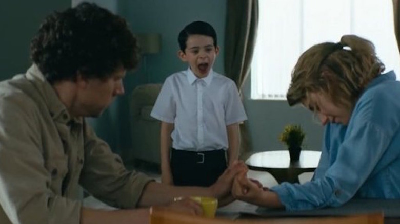 A boy screams at Imogen Poots and Jesse Eisenberg