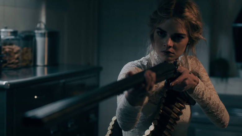 Samara Weaving aiming a shotgun in Ready or Not