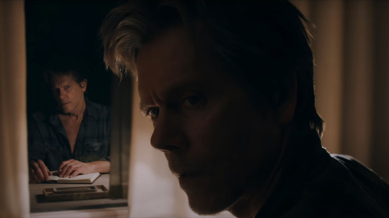 Kevin Bacon is being watched by another Kevin Bacon in the window in You Should Have Left