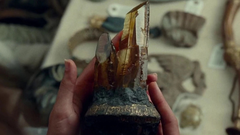 Diana's hands hold the Dreamstone