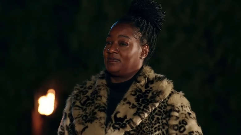 Cirie in coat smirking