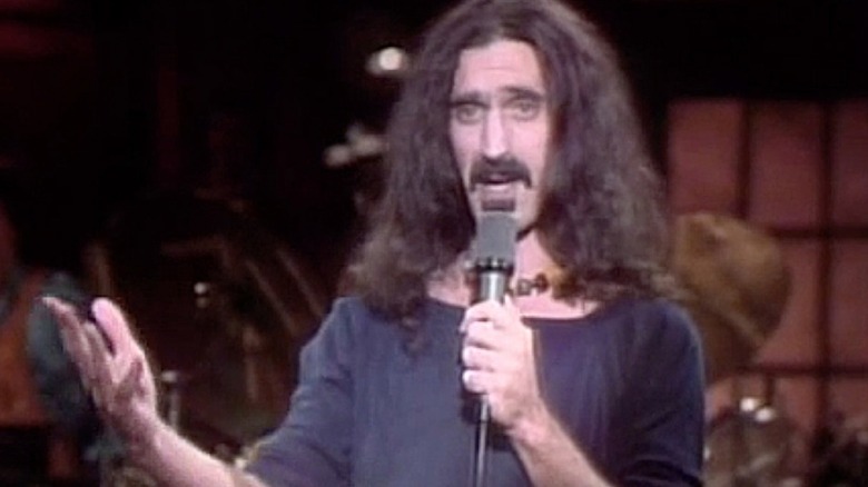 Frank Zappa speaking into microphone