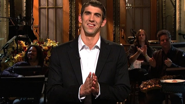 Michael Phelps smiling hands together