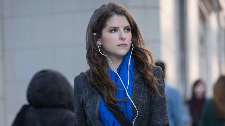 Beca wearing headphones 