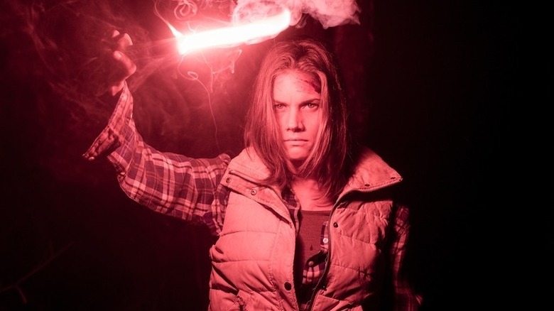 Missy Peregrym holds a flare