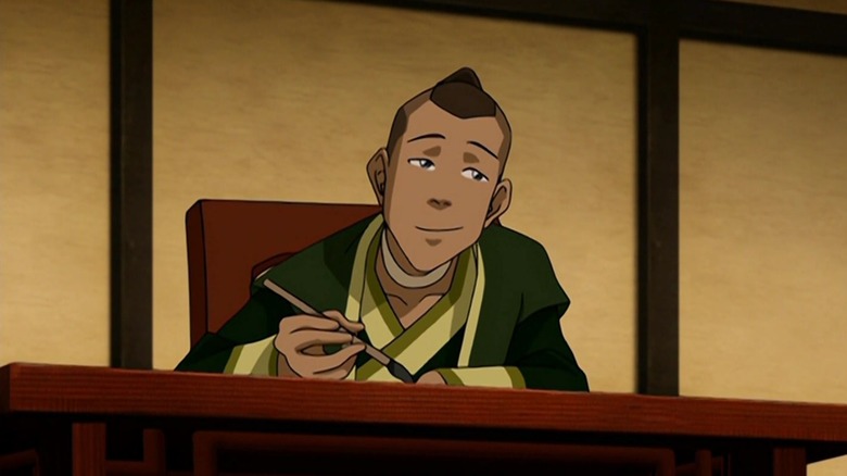 Sokka smiling and painting