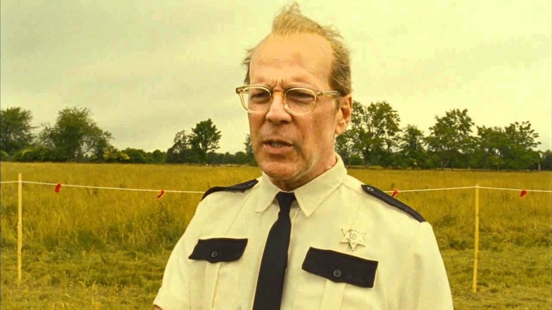 Captain Sharp stands by a field in "Moonrise Kingdom" (2012)