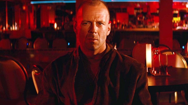 Butch Coolidge sits in a bar listening to Marsellus Wallace in "Pulp Fiction" (1994)