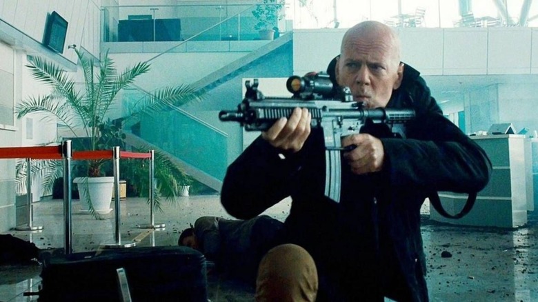 Church aims an M-4 with a scope in "The Expendables 2" (