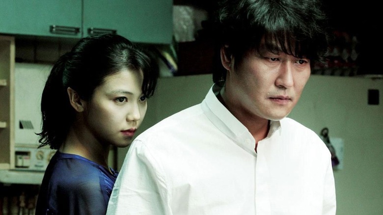 Tae-ju stands behind Sang-hyun in Thurst (2009)