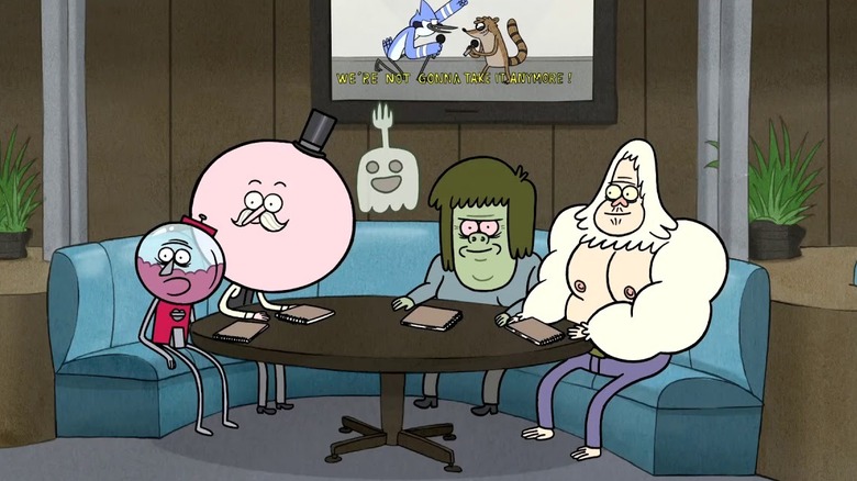 The group sits at a table while Mordecai and Rigby's karaoke video plays on Regular Show (2010)