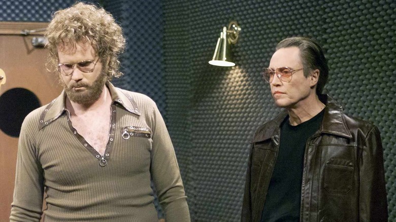 Will Ferrell as Gene Frenkle standing with Christopher Walken as Bruce Dickinson on SNL in 2000