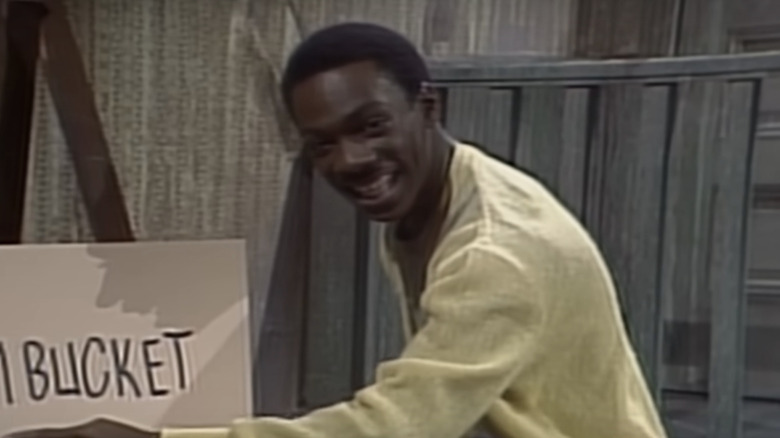 Eddie Murphy as Mr. Robinson pointing to a vulgar poster on "SNL" in 1981