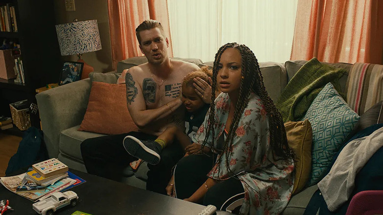 Miles and Ashley in a living room looking confused on Blindspotting