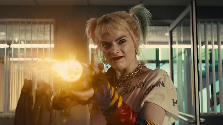 Harley Quinn shooting a gun