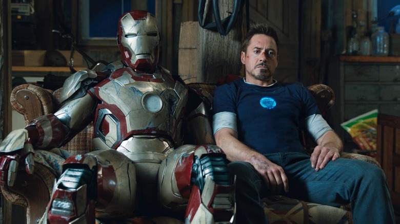 Tony Stark on couch with suit