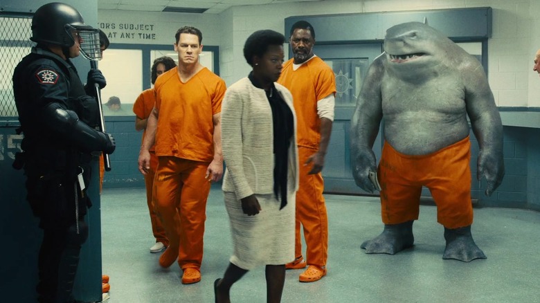 Amanda Waller walking past inmates