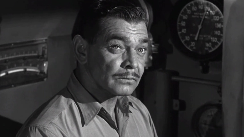 Clark Gable squints in submarine