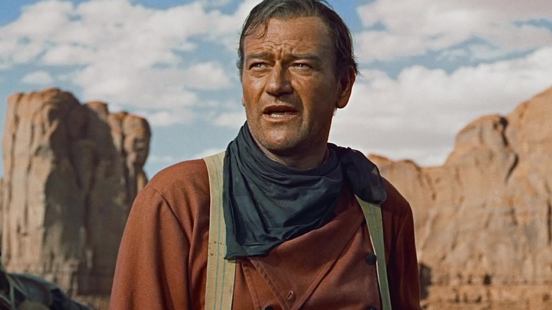 John Wayne in a Western landscape in The Searchers