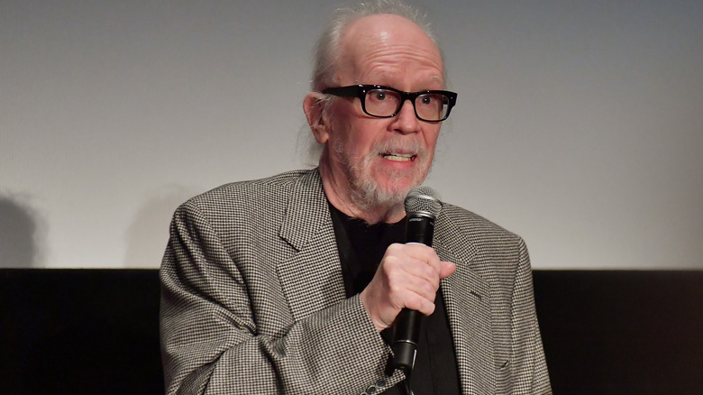 John Carpenter talking into microphone