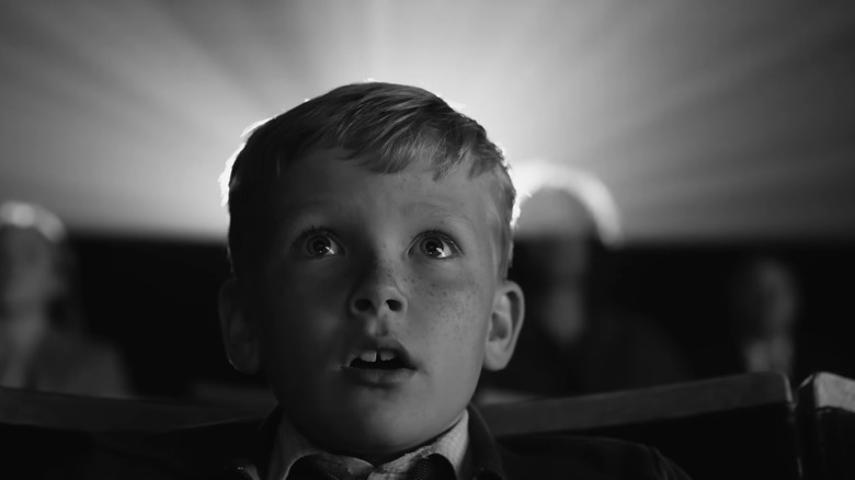 Boy staring amazed at cinema screen