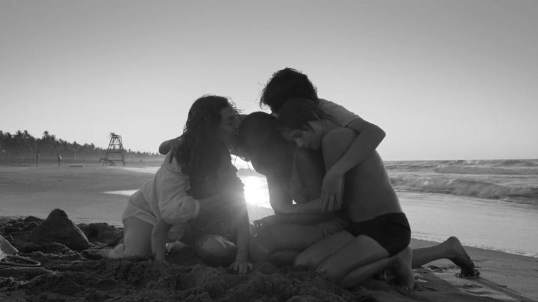 Family embracing on the beach