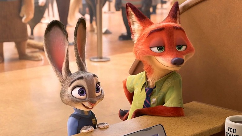 Judy and Nick lean on counter