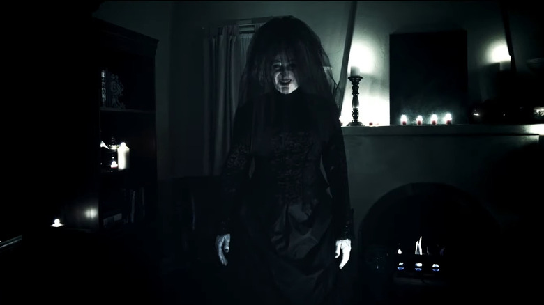 Insidious' the woman in black smiling