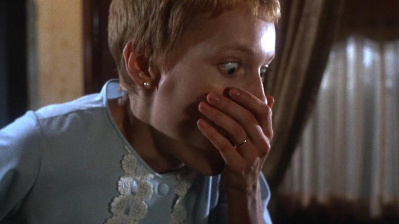 Rosemary Baby's Rosemary reacts in horror to her baby