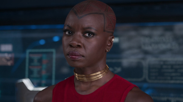 Okoye in a red dress