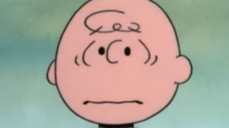 Charlie Brown scowling and sad