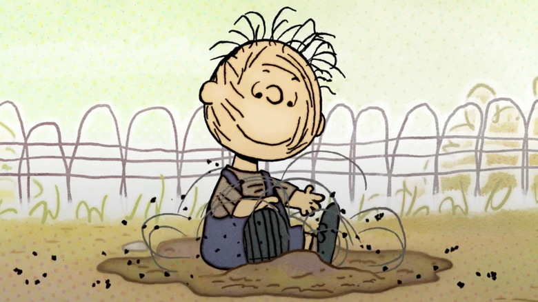 Pig-Pen plays in his dirt pile