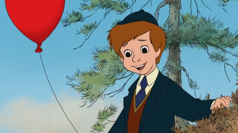 Christopher Robin smiling holding ballon