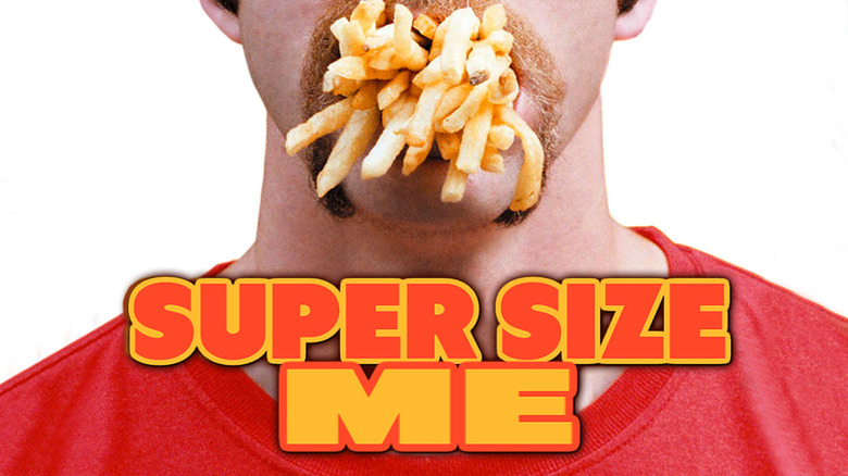 morgan spurlock with fries stuffed in mouth