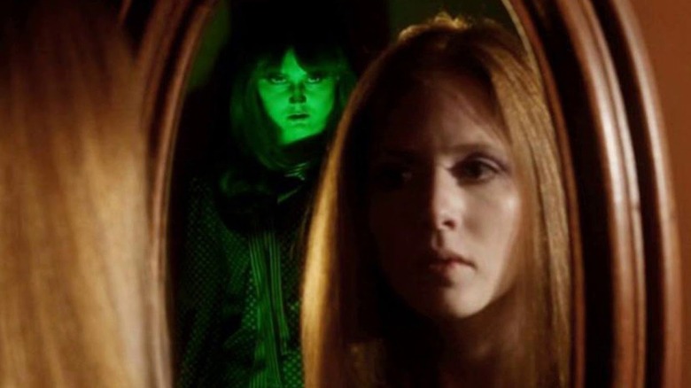 Joan and specter in mirror