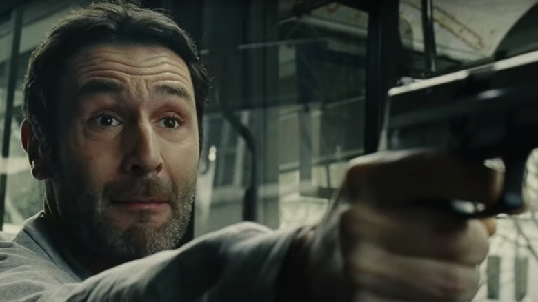  Gilles Lellouche aiming gun