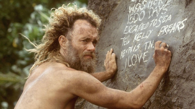 Tom Hanks with long hair and a beard 