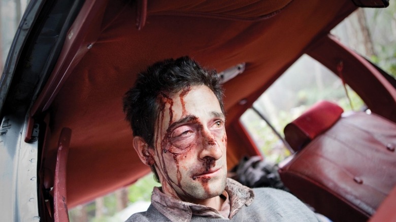 Adrien Brody with blood on his face 