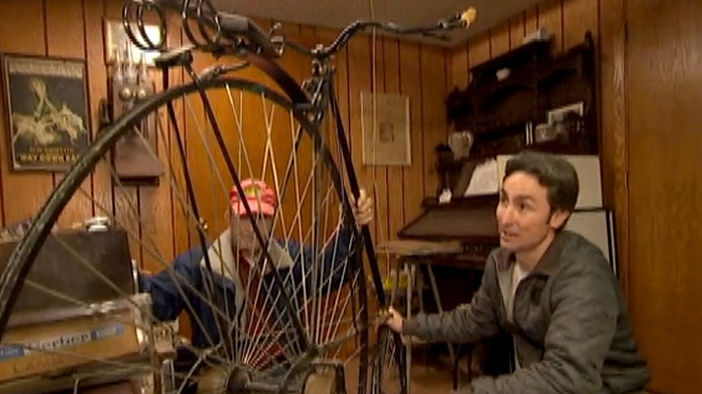 Mike Wolfe admires bicycle