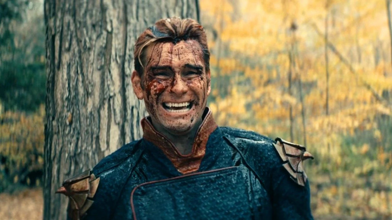 Bloody Homelander grinning in forest