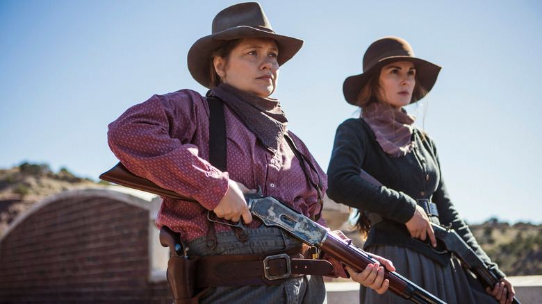 Alice and Mary Agnes with rifles