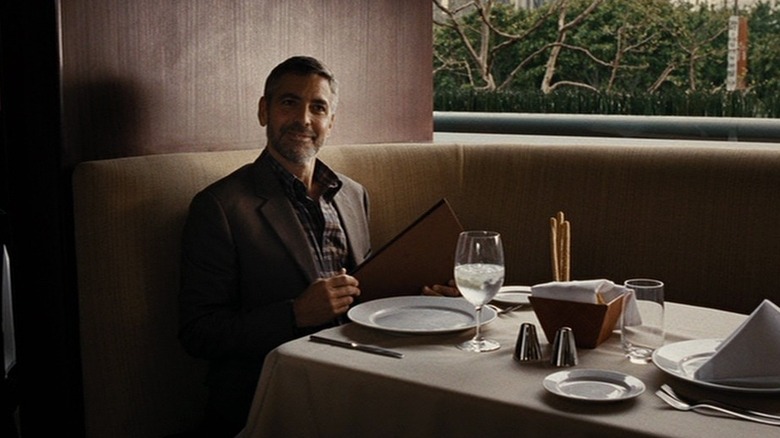 Harry Pfarrer smiling in restaurant booth