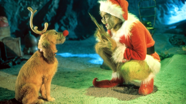 Grinch talking to reindeer Max